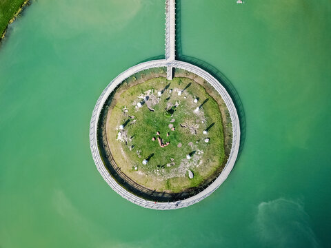 Aerial view of Rabbit island and rounded bridge in Naisiai, Lithuania