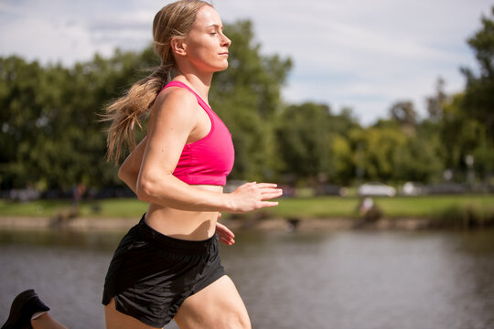 Young Woman Jogging By The Yarra River Melbourne