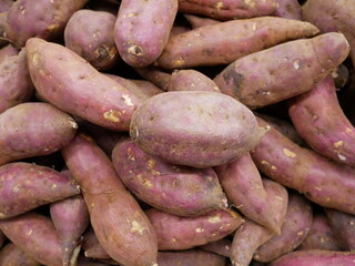 pile of sweet potato for sale on supermarket.