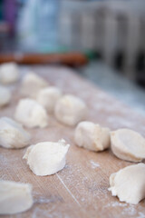 Fototapeta na wymiar White dough on chopping board