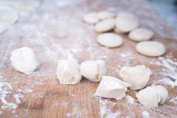 Fototapeta na wymiar White dough on chopping board