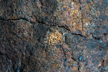 Macro photo of the fusion crust from a Chondrite Meteorite, piece of rock formed in outer space in the early stages of Solar System as asteroids. This meteorite comes from an asteroid fall at Atacama