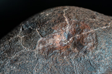 Macro photo of the fusion crust from a Chondrite Meteorite, piece of rock formed in outer space in...