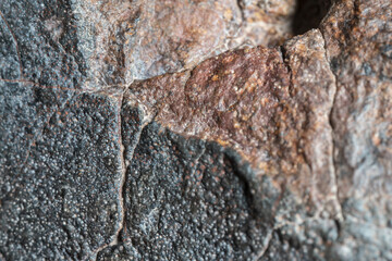 Macro photo of the fusion crust from a Chondrite Meteorite, piece of rock formed in outer space in...