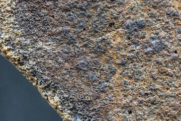 Macro photo of the fusion crust from a Chondrite Meteorite, piece of rock formed in outer space in...