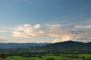 Fototapeta premium The white clouds have a strange shape and moutain.