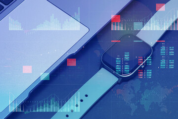 Business analytics with key performance indicators dashboard concept. Smart watch and silver laptop on a dark background.