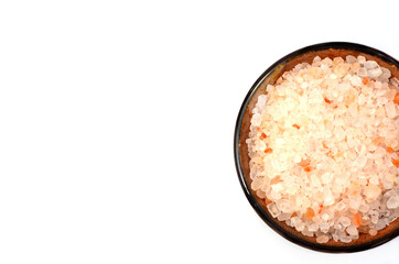 pink himalayan salt in ceramic plate isolated on white background, concept of healthy spices and food