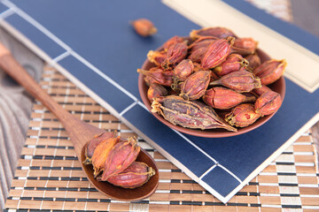 Gardenia fruit in the medical books and in the wooden spoon
