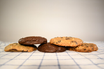  a pile of alomod chocolate cookie on white background