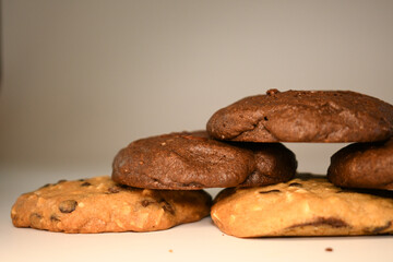  a pile of alomod chocolate cookie on white background