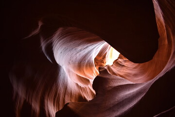 Rays of light shine through crevices within Antelope Canyon, Arizona