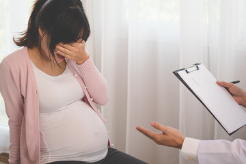 Young asian pregnant women have psychologist consultation at hospital or clinic,from panic and worried pregnancy condition, expecting family.Which must be treated with therapy before the baby is born.