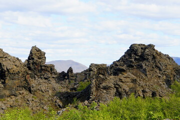Fototapeta na wymiar The view of the unique rock structure at Dimmuborgir Lava Formations near Lake Myvatn, Iceland