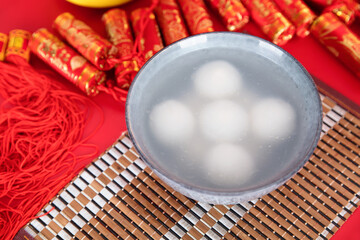 Firecracker pendant and a bowl of Tangyuan