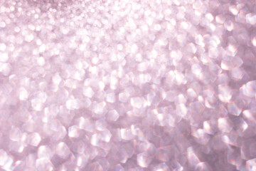 Defocused abstract pink twinkle light background.  Pink gold glittery bright shimmering background use as a design backdrop.
