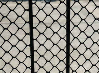 Fototapeta premium steel fence with thick grid net for security