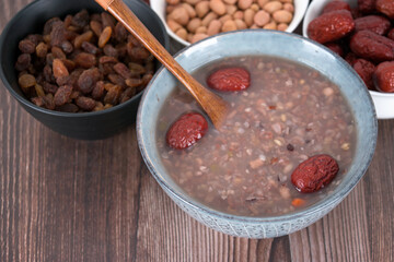 A bowl of Laba porridge and some dried fruit ingredients