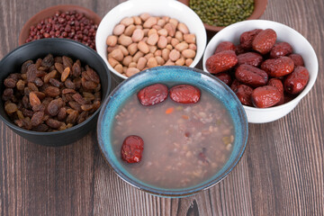 A bowl of Laba porridge and some dried fruit ingredients