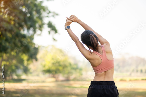 Young Adult Female In Pink Sportswear Stretching Muscle In The Park  Outdoor, Sport Woman Warm Up Ready For Running And Jogging In Morning  Wellness, Fitness, Exercise And Work Life Balance Concepts Arm