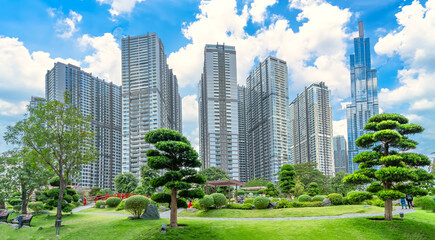 Obraz premium Skyscrapers viewed from below towards sky represents urban development with modern architecture to bring international in Ho Chi Minh City, Vietnam