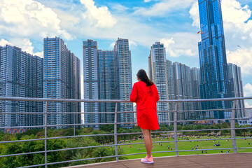 Female tourists are watching urban architecture busy urban areas showing prosperous economic development in Ho Chi Minh City, Vietnam