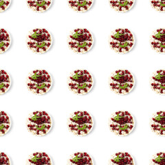 Seamless pattern from galettHealthy breakfast with rice cake and pomegranate on white flat lay