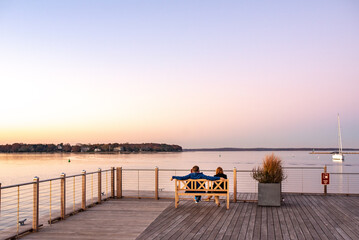 couple watching sunset at marina