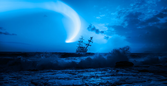 Old Sailing-ship in storm sea with Comet on the sky, dramatic sunset in the background