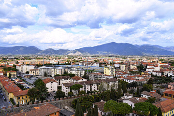 Fototapeta na wymiar view of the surrounding city and mountain range from the pisa tower