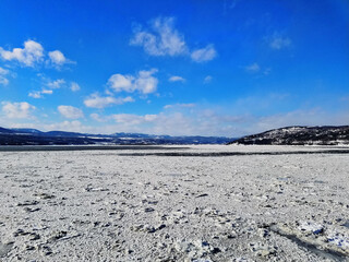 Obraz premium melting ice sheets still hard enough as the winter ceases at 