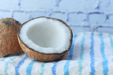 slice of fresh coconut on a table cloth 