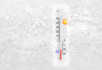 Outdoor thermometer on a frozen window shows minus 19 degrees celsius temperature in cold winter day