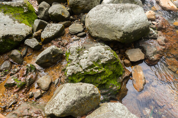Naklejka na ściany i meble Photo of large rocks in the river