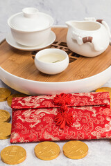 Tea sets and red envelopes on the table