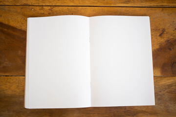Blank book cover mock up on wood  background.