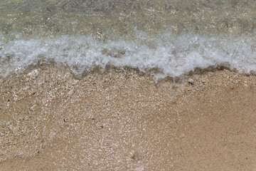 Wave on beach close up shot day time