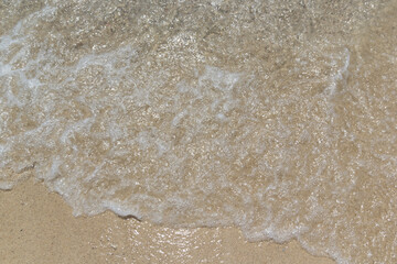 Wave on beach close up shot day time