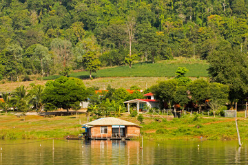 Boat house in the dam, surfers, rest and fishing