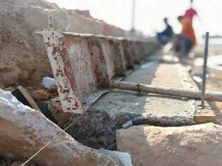 Blurred images of concrete road construction and curb