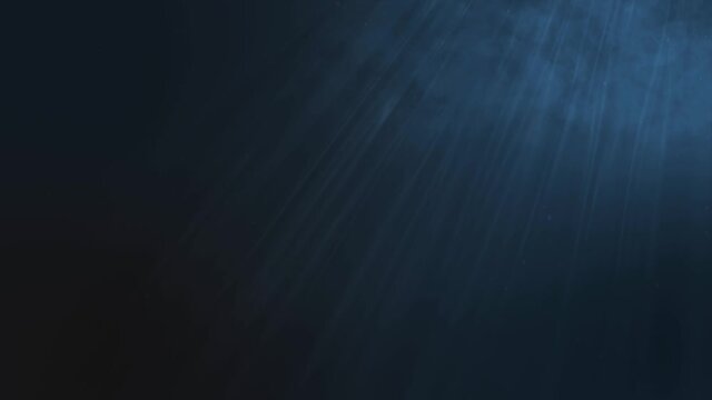 Deep Ocean animation. 4K render looking up towards the sea's surface from the depths as waves break and light rays shine through the darkness.