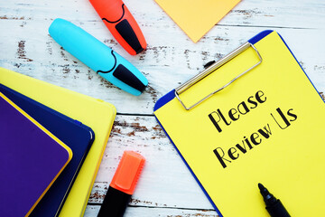 Financial concept about Please Review Us with inscription on the sheet.