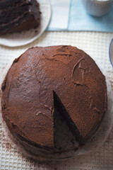 Chocolate layered cake. Dark chocolate cake made on buttermilk and cola