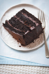 Chocolate layered cake. Dark chocolate cake made on buttermilk and cola