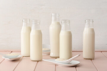 Bottles of rice milk on table
