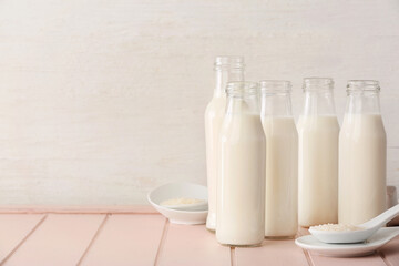 Bottles of rice milk on table