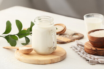 Obraz na płótnie Canvas Mason jar of rice milk on table