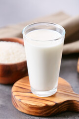 Glass of rice milk on table