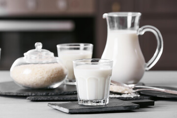 Fototapeta na wymiar Glass of rice milk on table