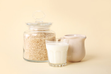 Glass of rice milk on color background